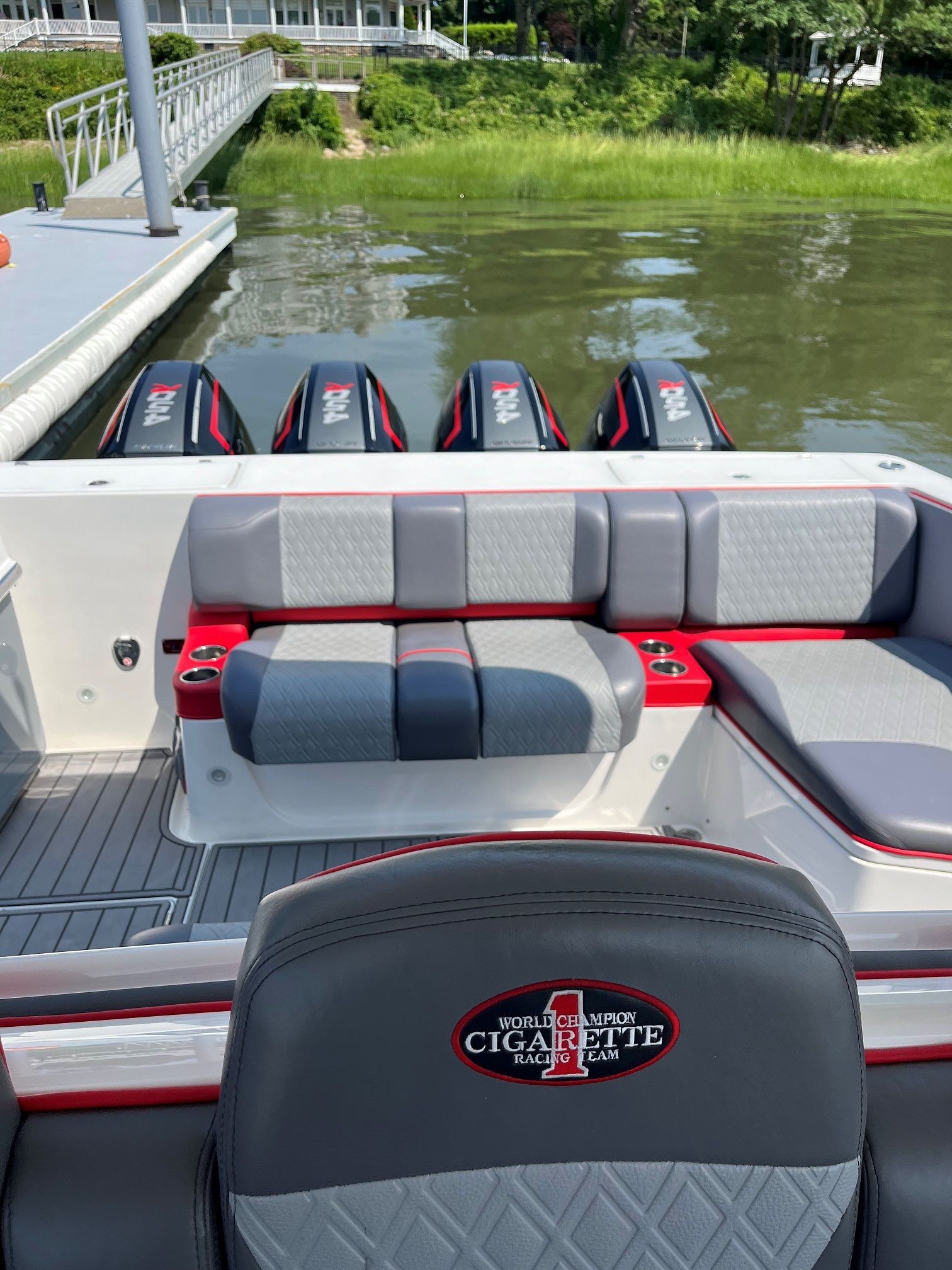 The back of a boat is sitting in the water.