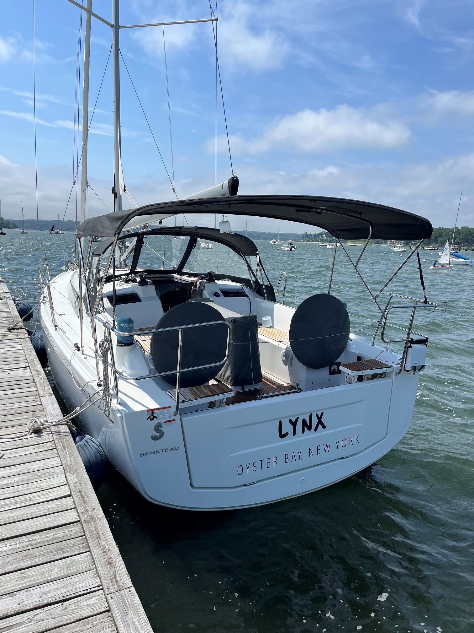 A sailboat is docked at a dock in the water.