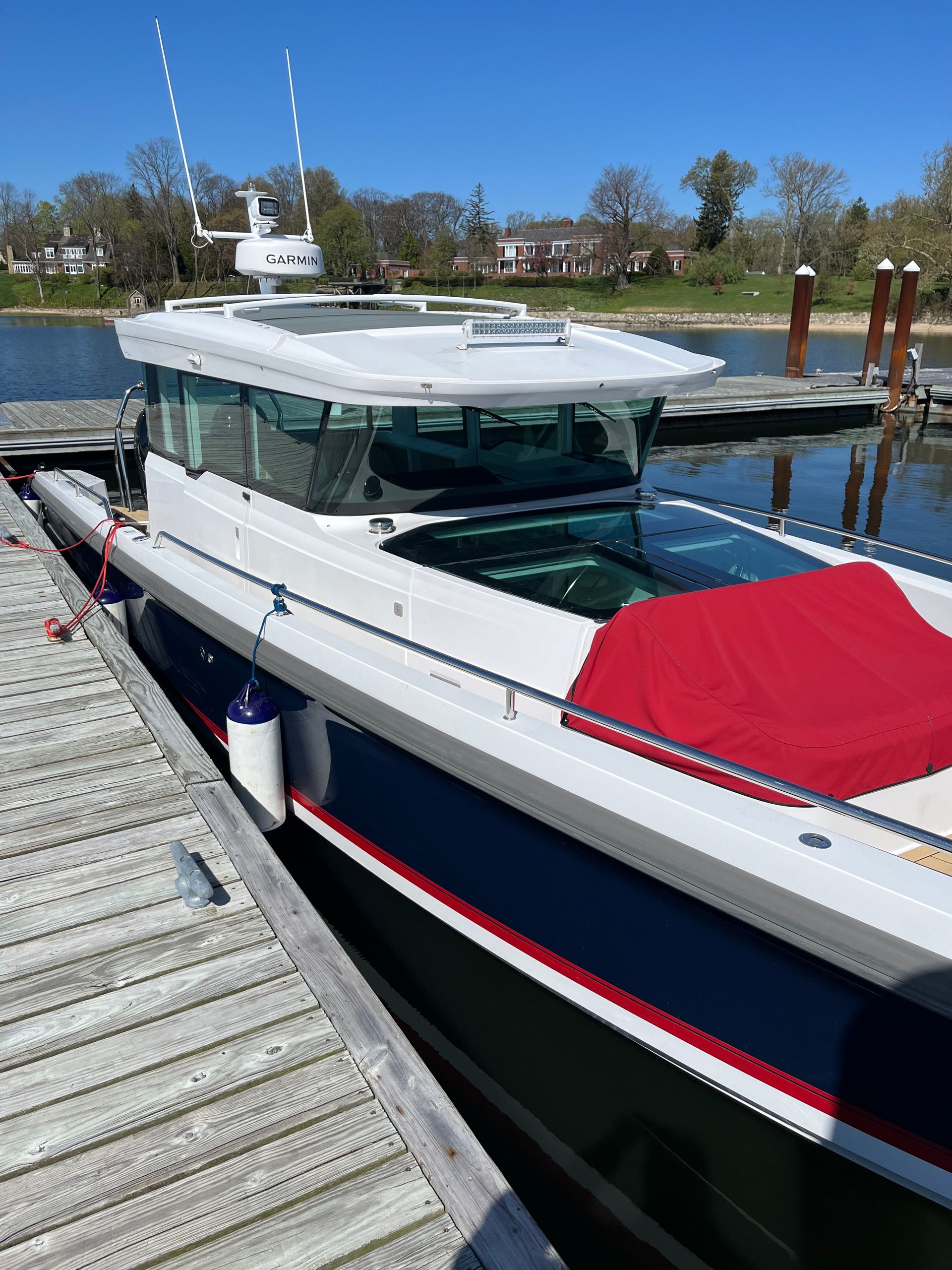 A boat is docked at a dock on a sunny day