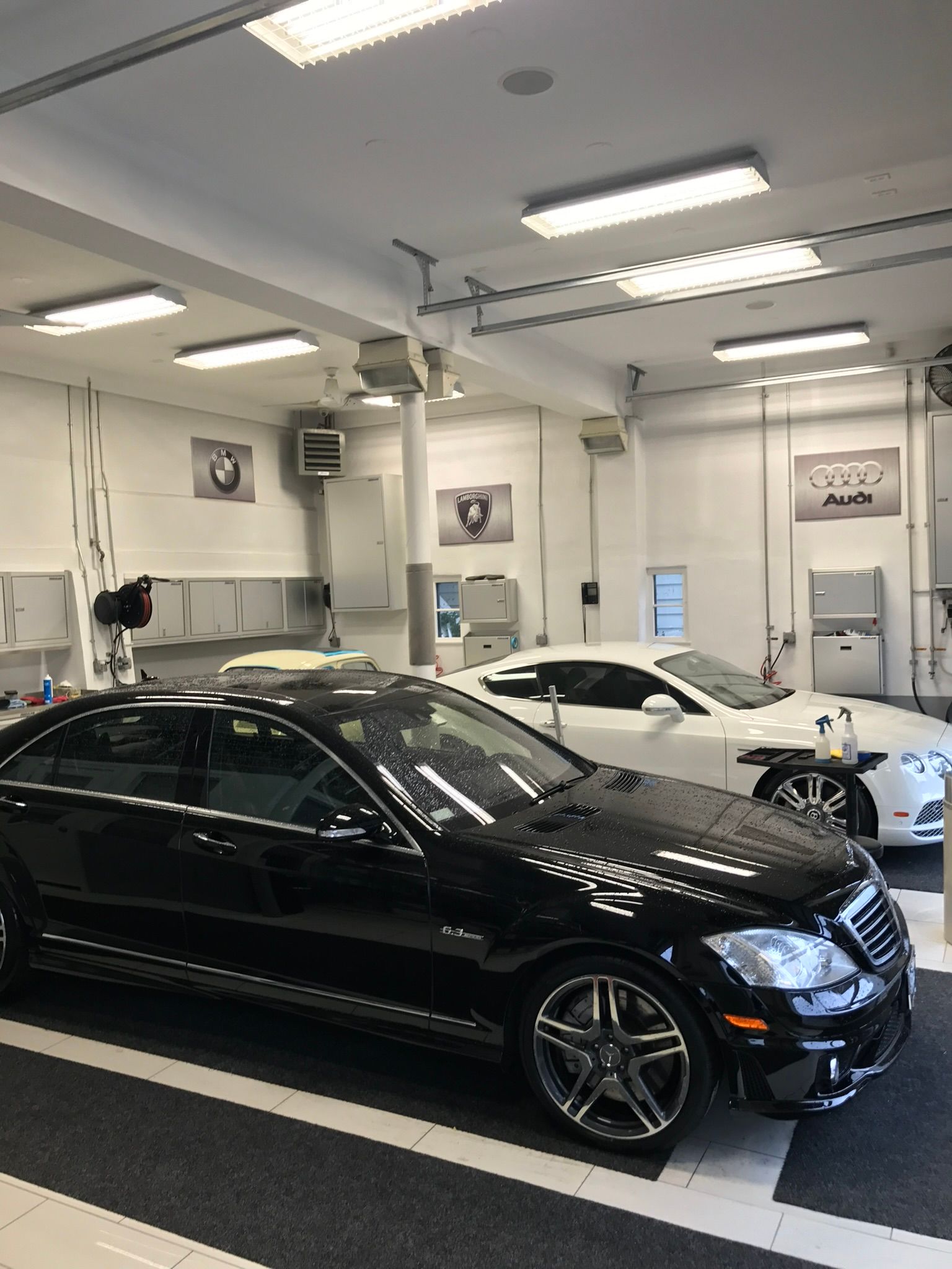 black and white car in detailing garage