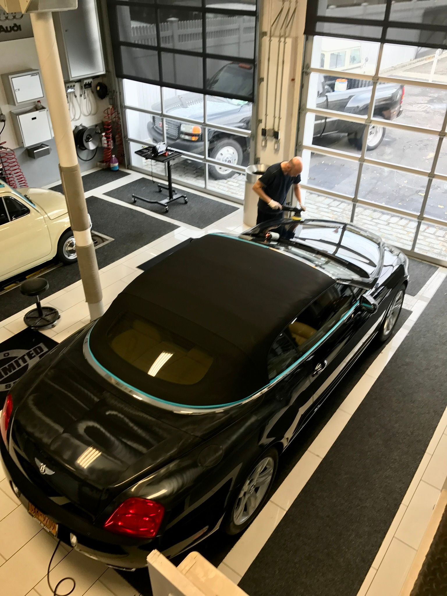 Man working on a black car