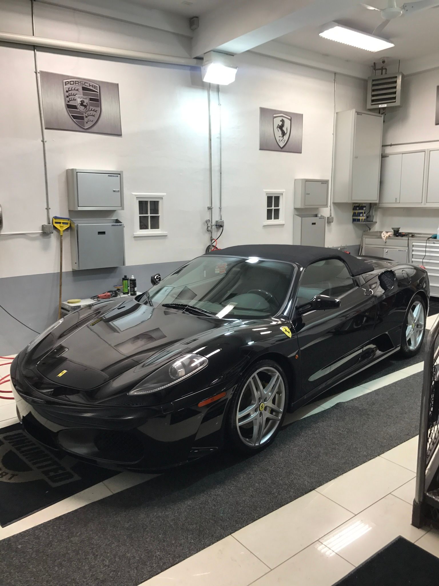 black Ferrari in a garage