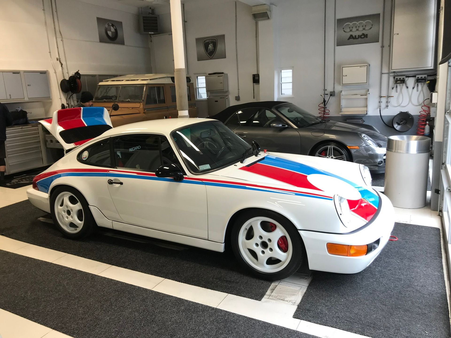 white car with blue and red details