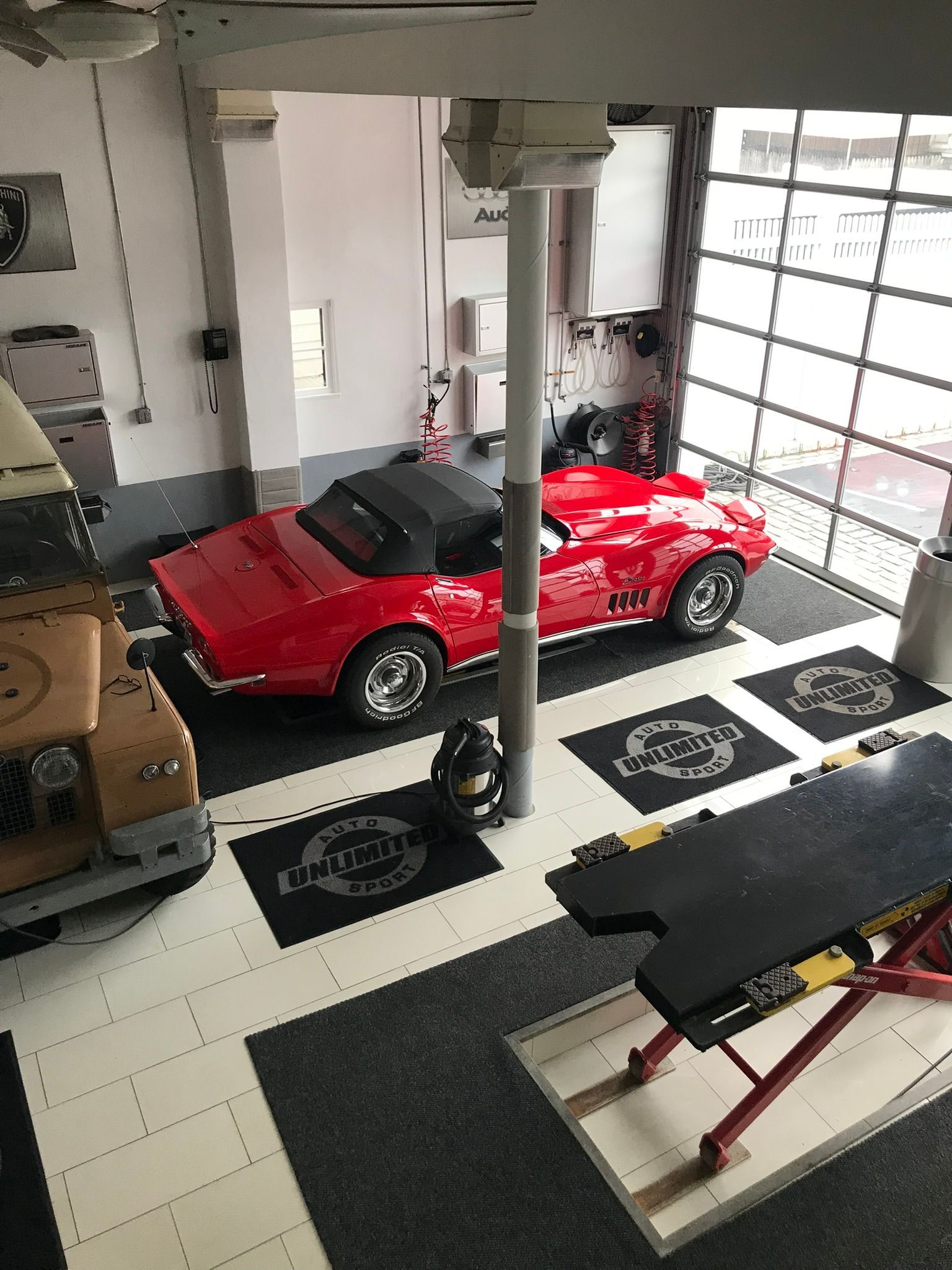 red sports car in a auto detailing garage