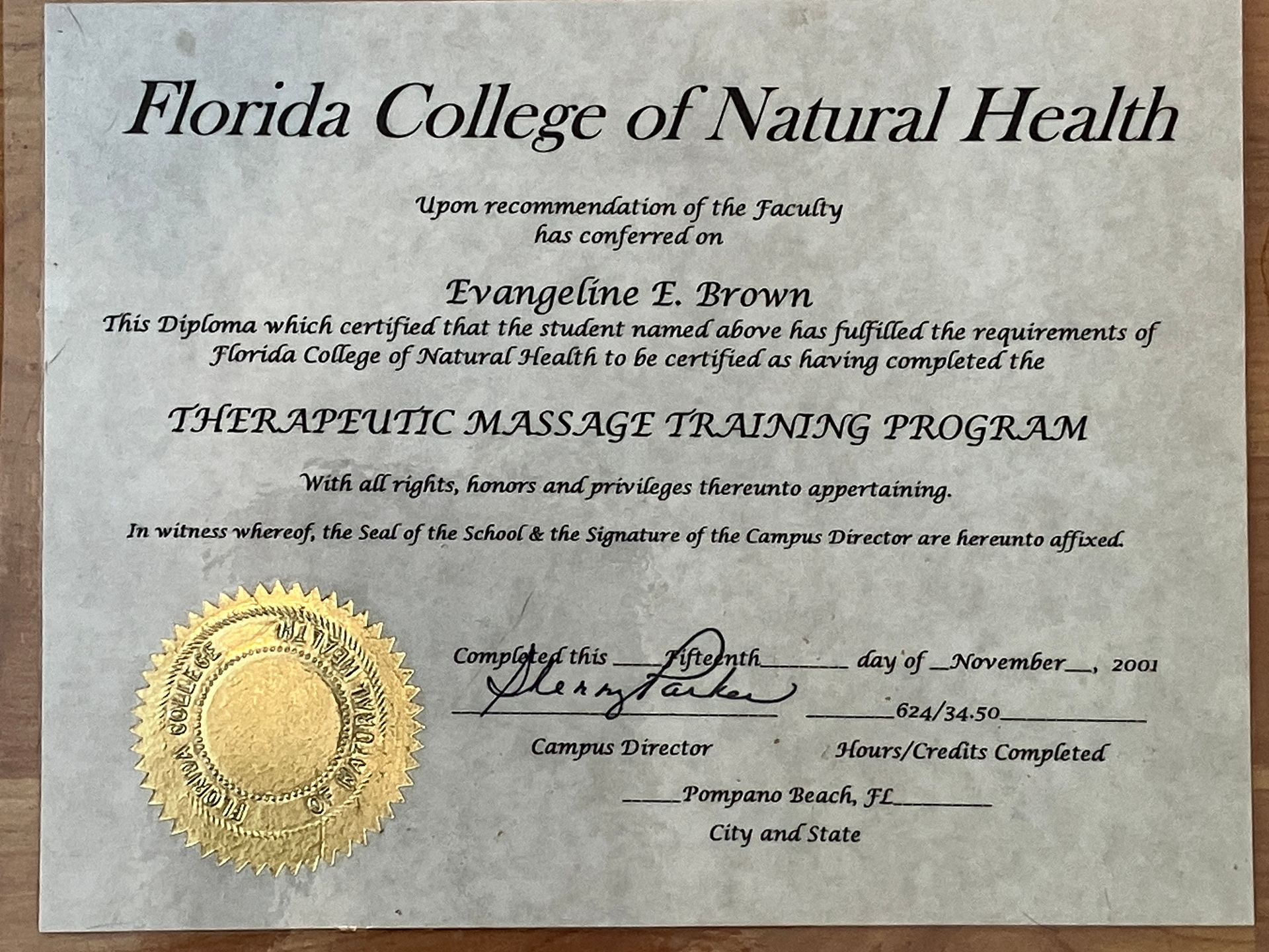 Florida College of Natural Health diploma/certificate with gold seal and handwritten signatures