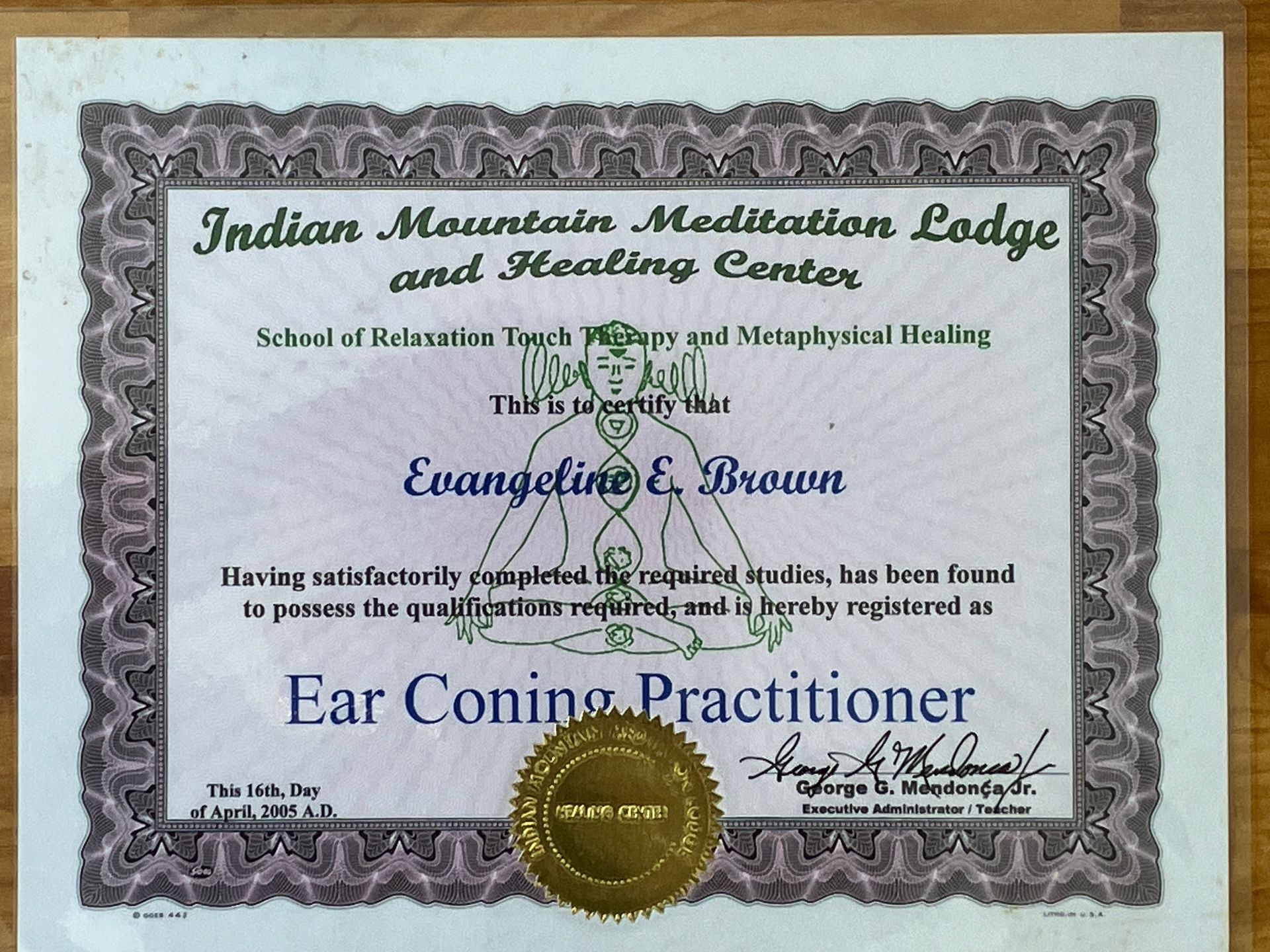 Certificate for Ear Coning Practitioner from Indian Mountain Meditation Lodge and Healing Center, with gold seal.
