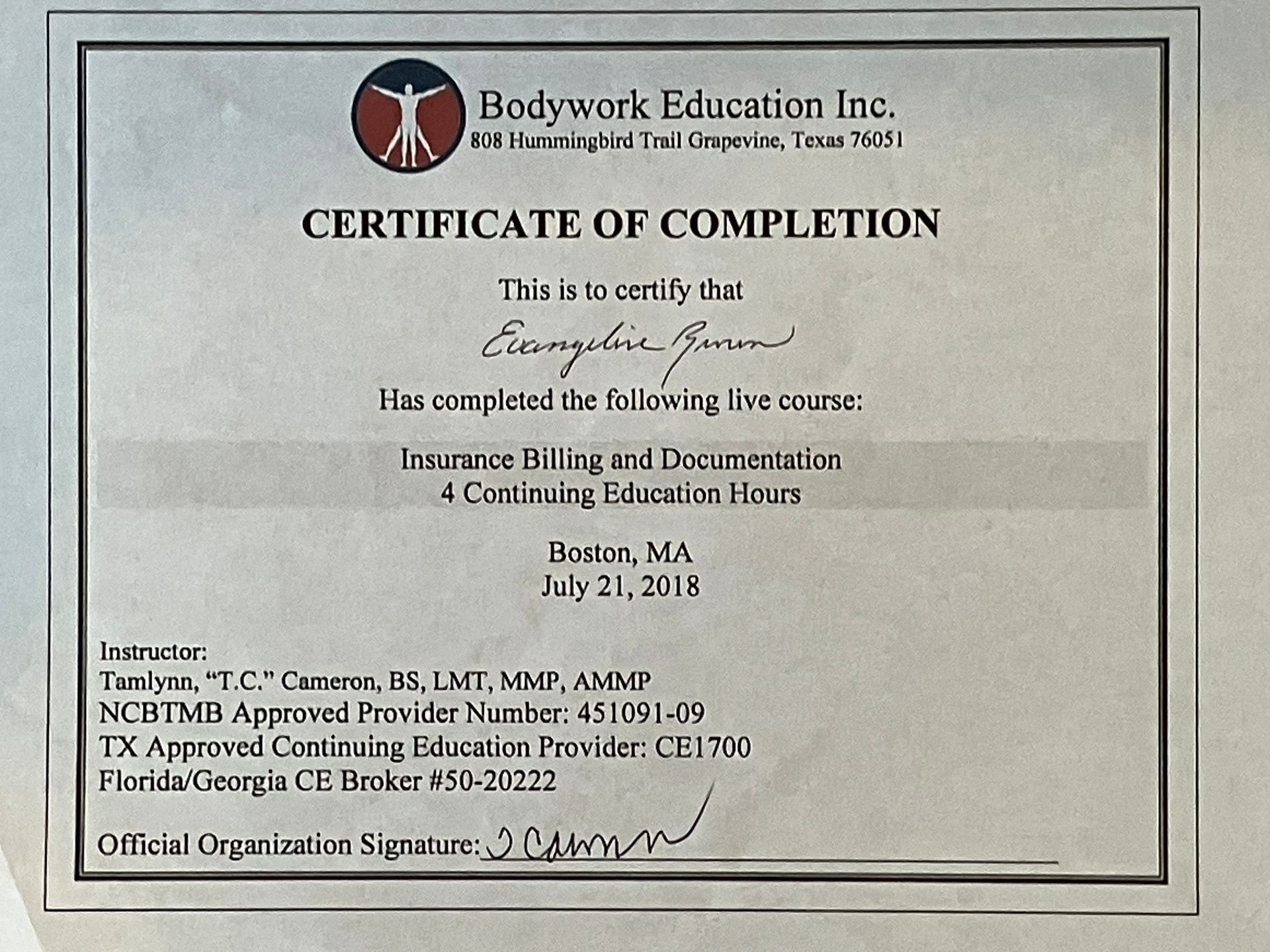 Framed Certificate of Completion from Bodywork Education Inc. with black text on cream paper.