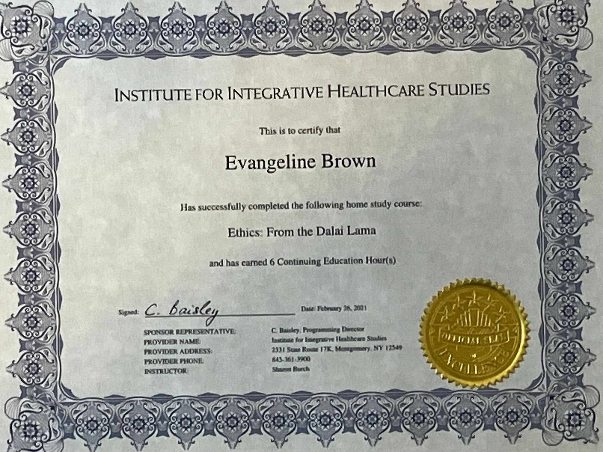 Framed certificate from Institute for Integrative Healthcare Studies with gold seal and gray ornate border