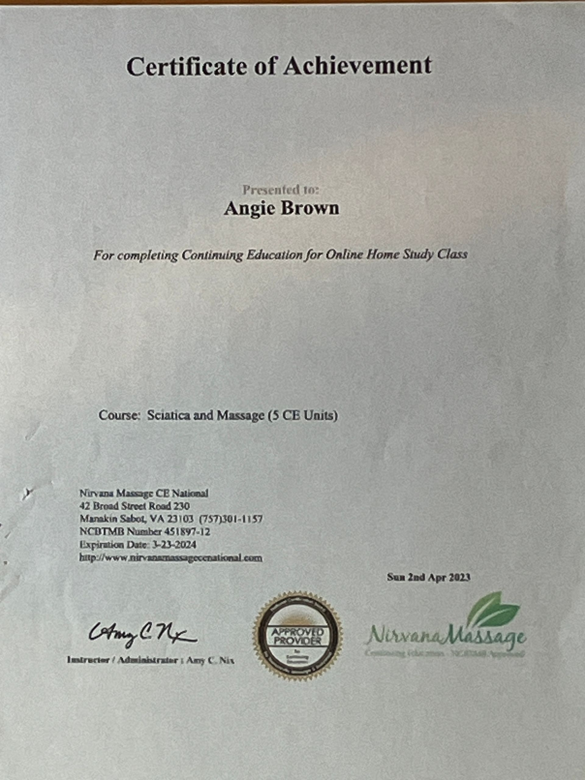 Certificate of Achievement for Angie Brown, with school logo and signatures on a light background