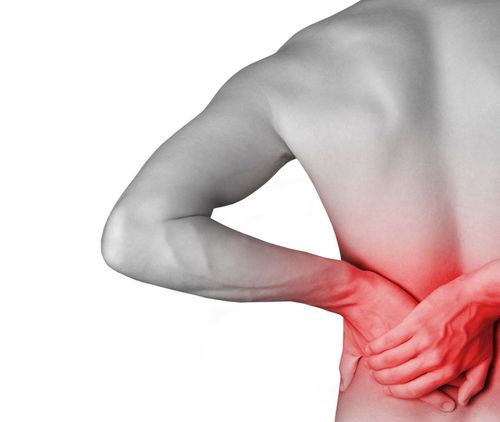Person holding lower back with red-highlighted pain area, indicating back pain
