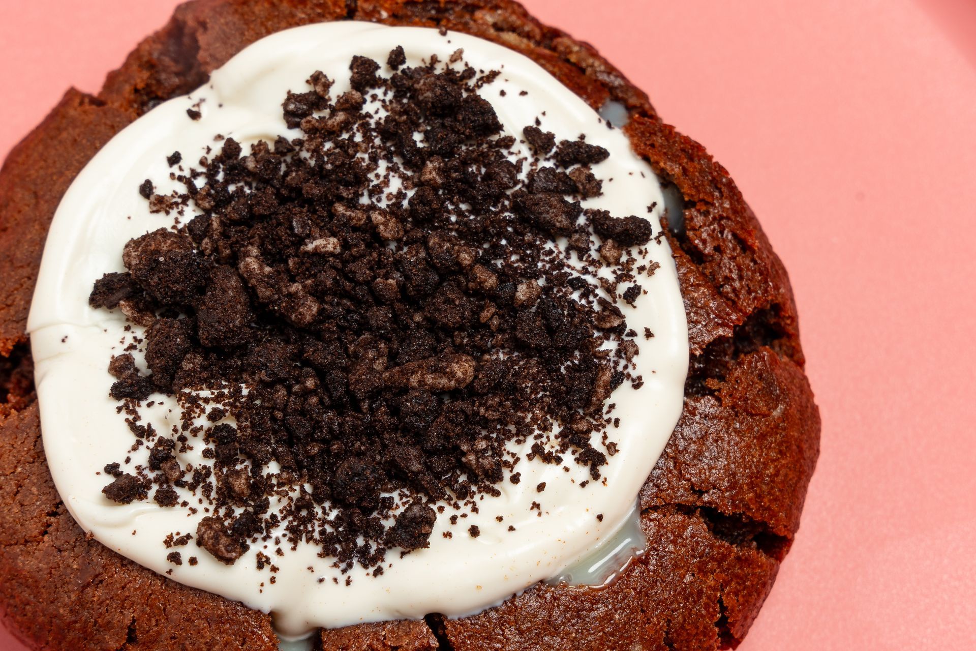 A stack of cookies with whipped cream on top of them