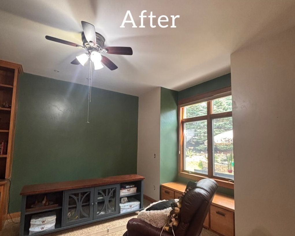 A room with a brown ceiling and walls, a window, and a cabinet - after