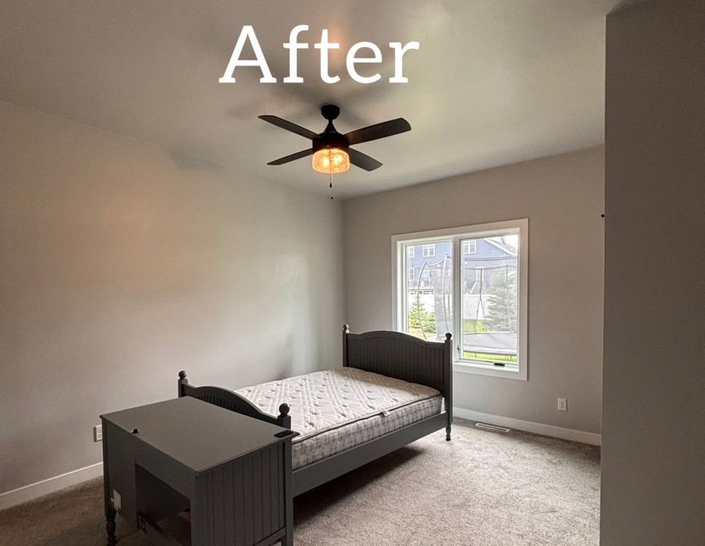 Bedroom with gray walls, bed, window, and ceiling fan. - after
