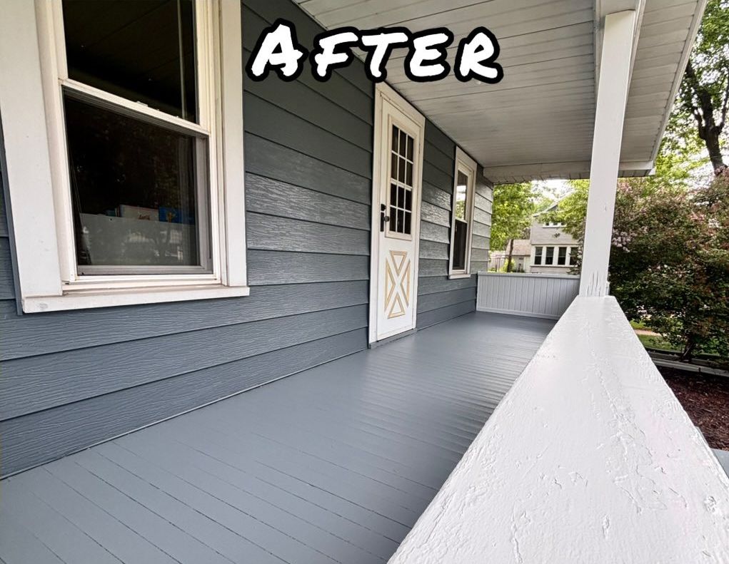 Exterior porch with peeling white railing, light green siding, and gray flooring.- after