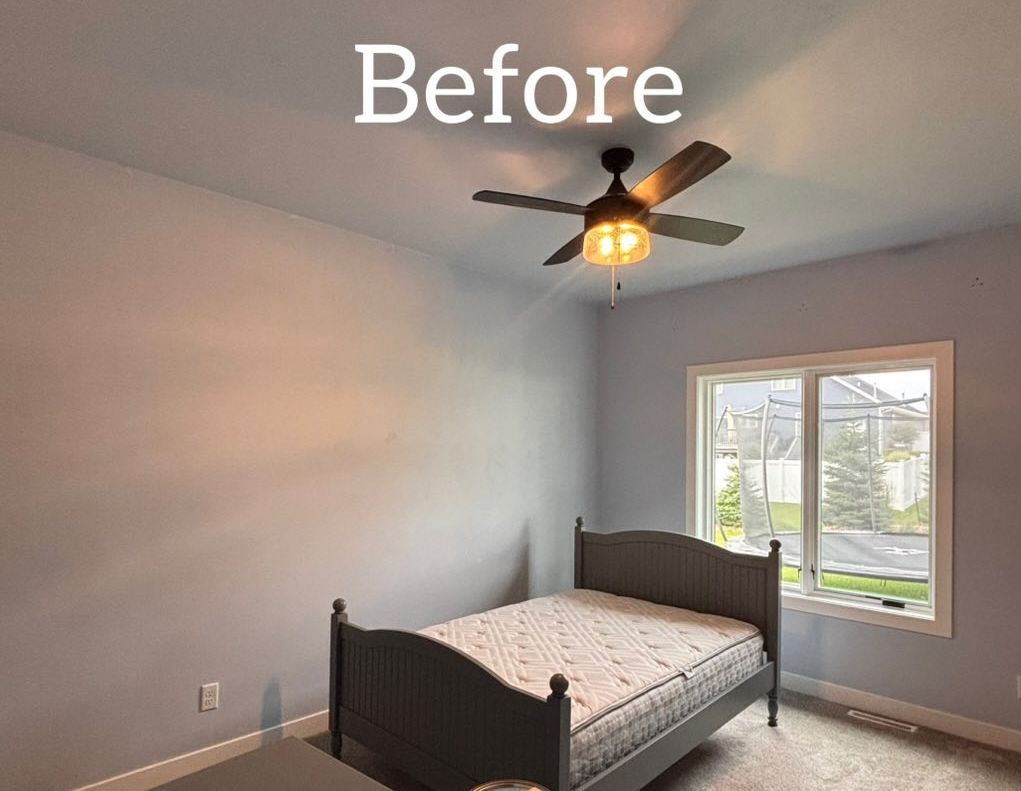 Bedroom with gray walls, bed, window, and ceiling fan. - before