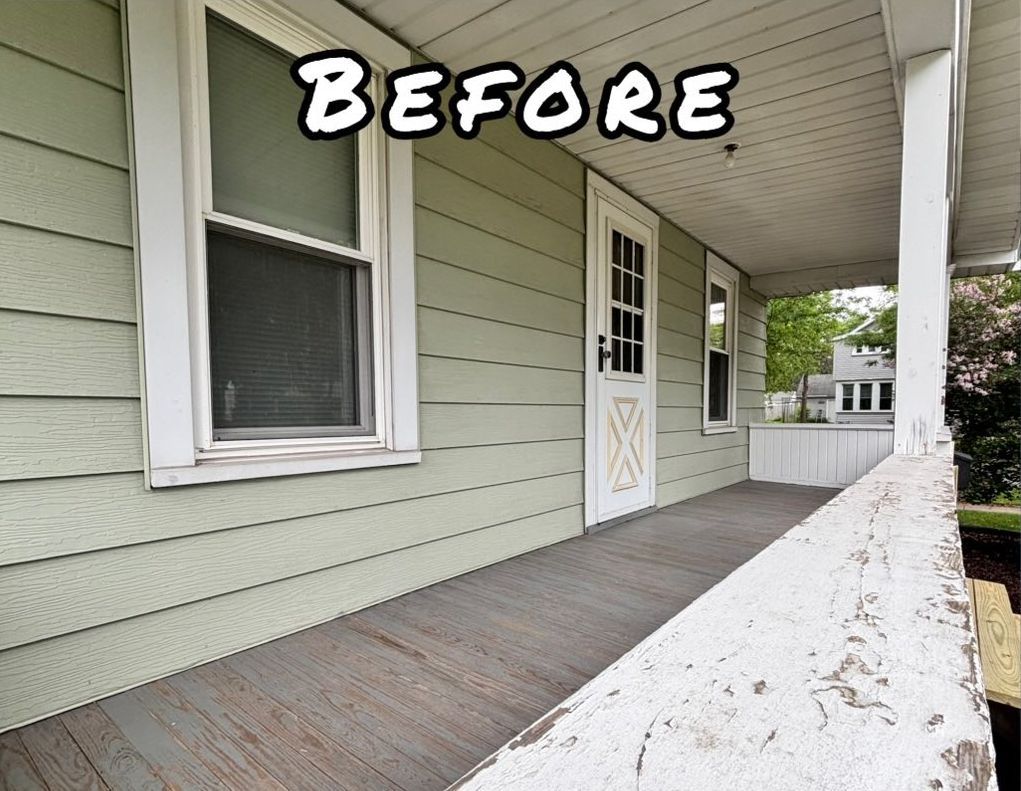 Exterior porch with peeling white railing, light green siding, and gray flooring.- before