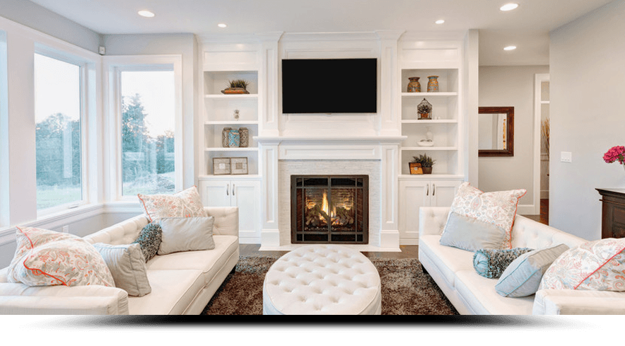 A living room with two couches , a fireplace and a flat screen tv.