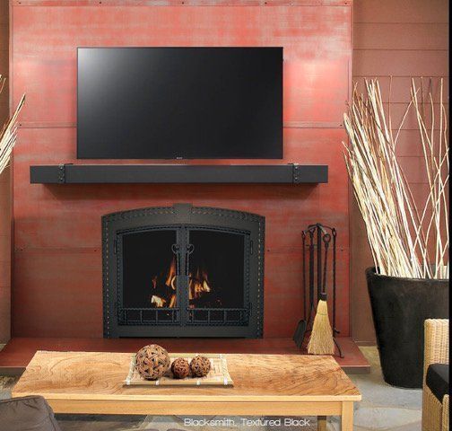 A living room with a fireplace and a flat screen tv