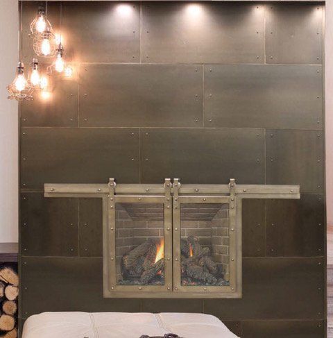 A fireplace with sliding glass doors in a bedroom