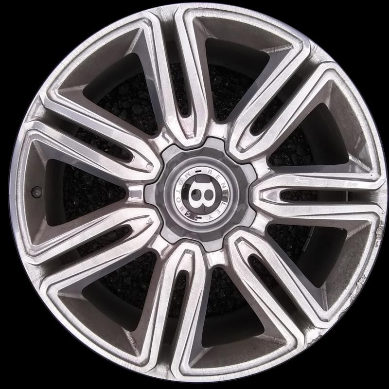 A bentley wheel is shown on a black background