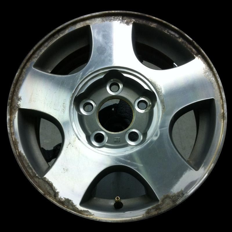 A close up of a wheel with a black background