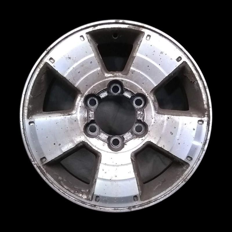 A close up of a wheel on a black background