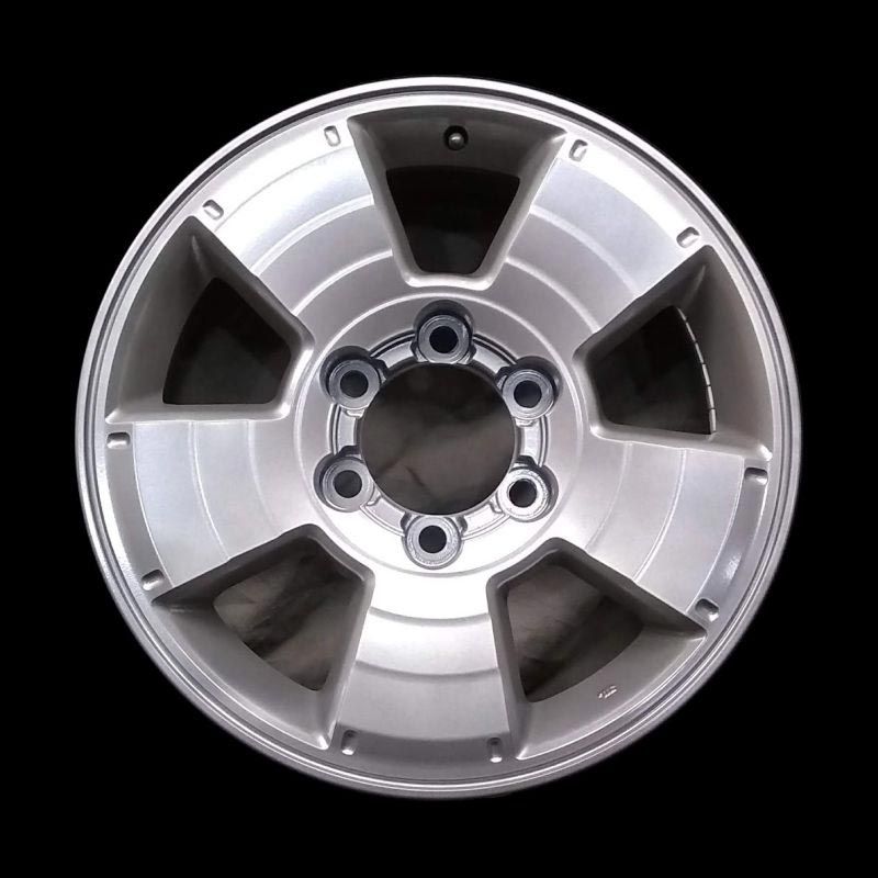 A close up of a silver wheel on a black background