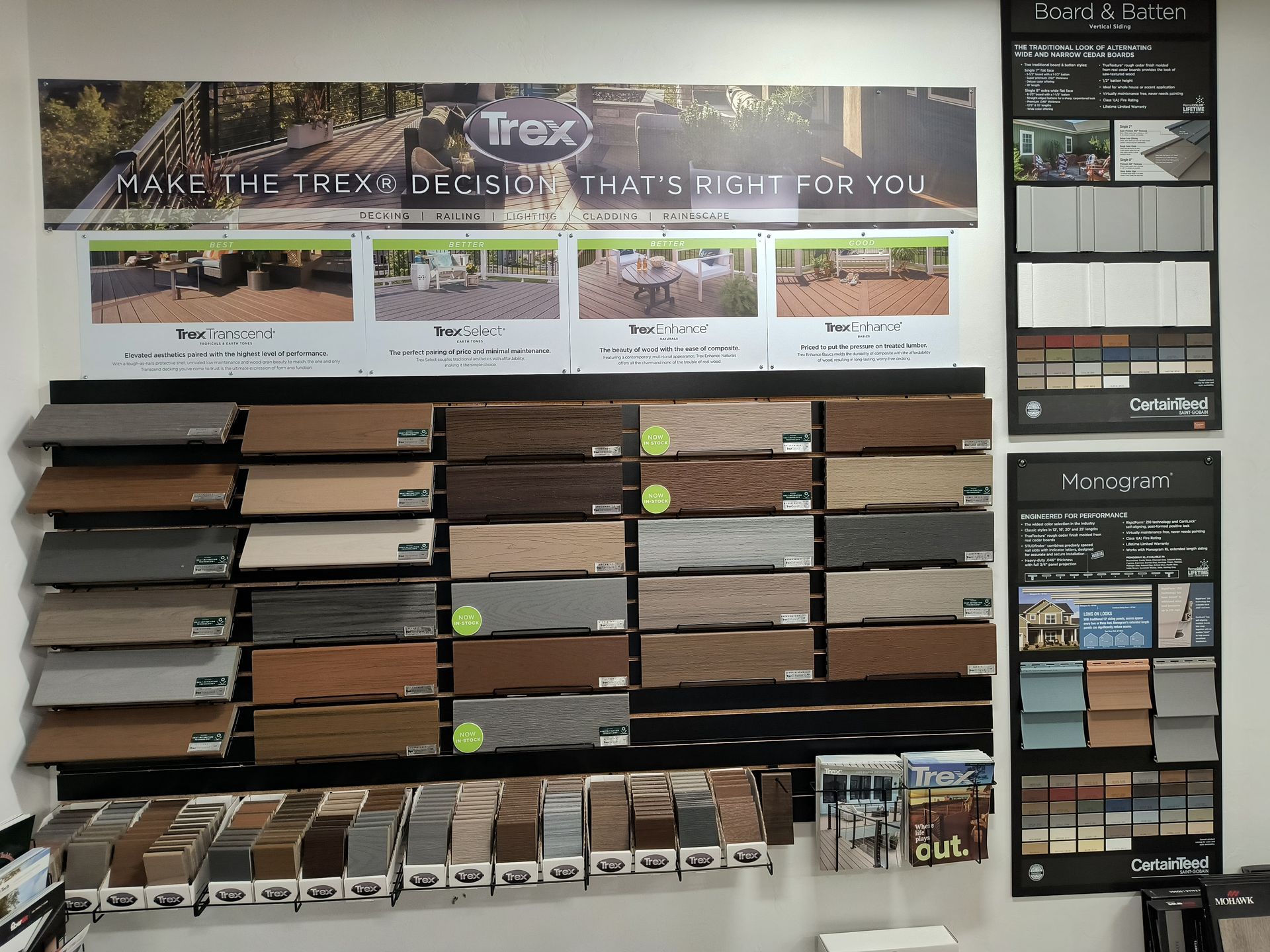 Display of Trex deck samples with various colors and styles, marketing materials, and information charts.