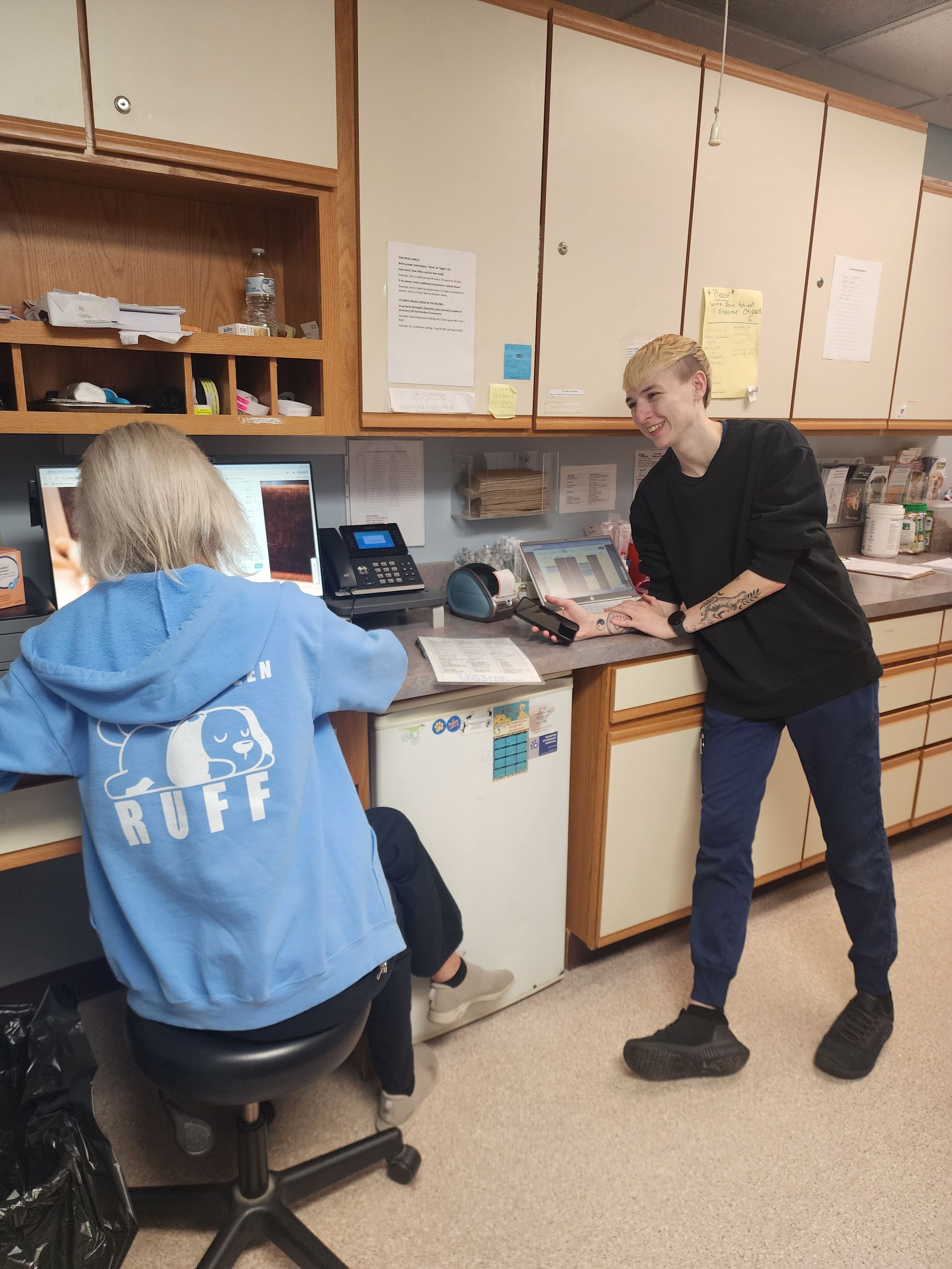 Two women are standing next to each other in a kitchen