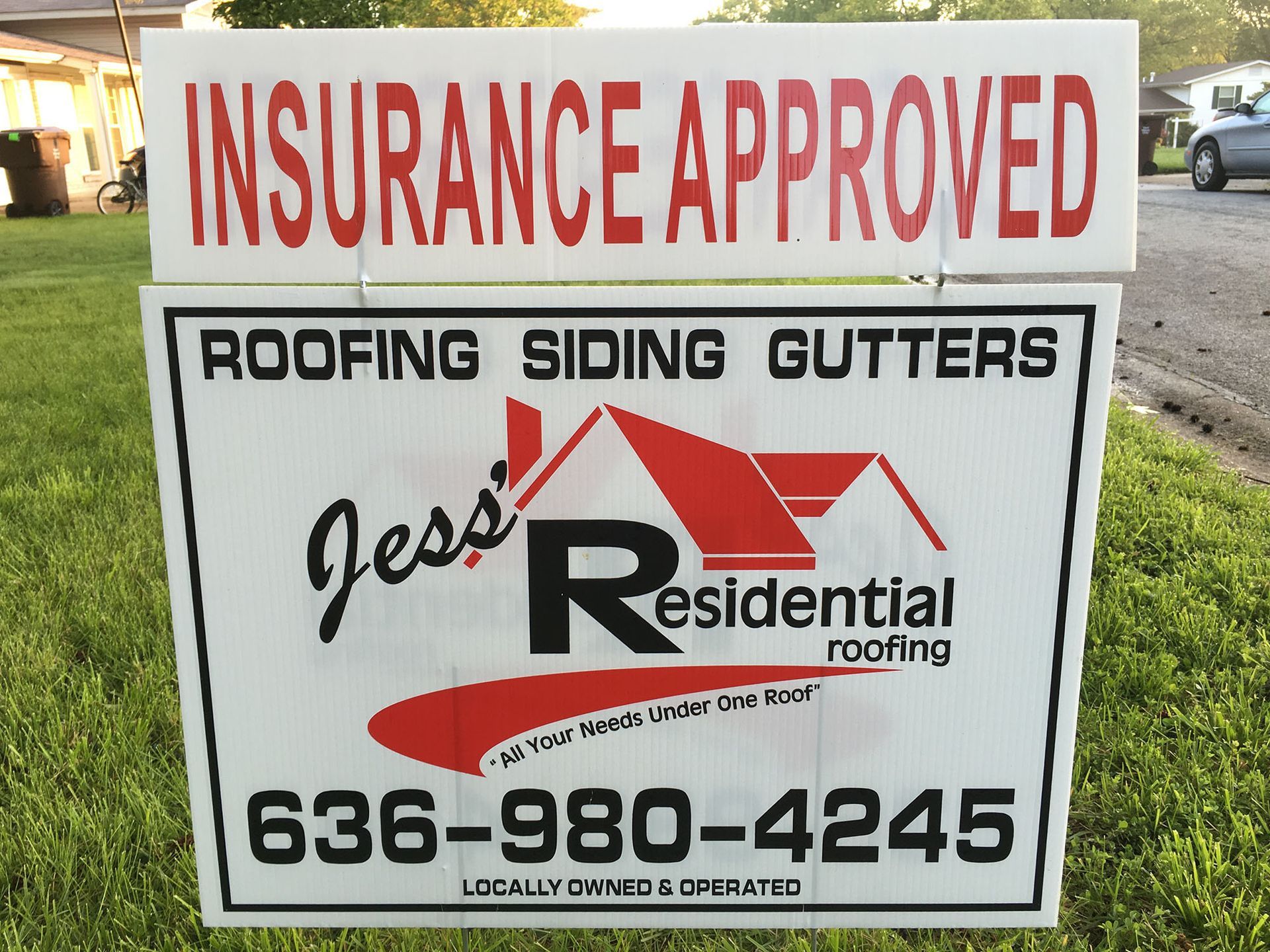 An insurance approved sign for jess residential roofing