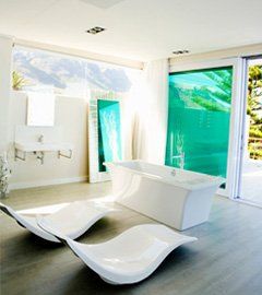 Luxury bathroom with tub and seating