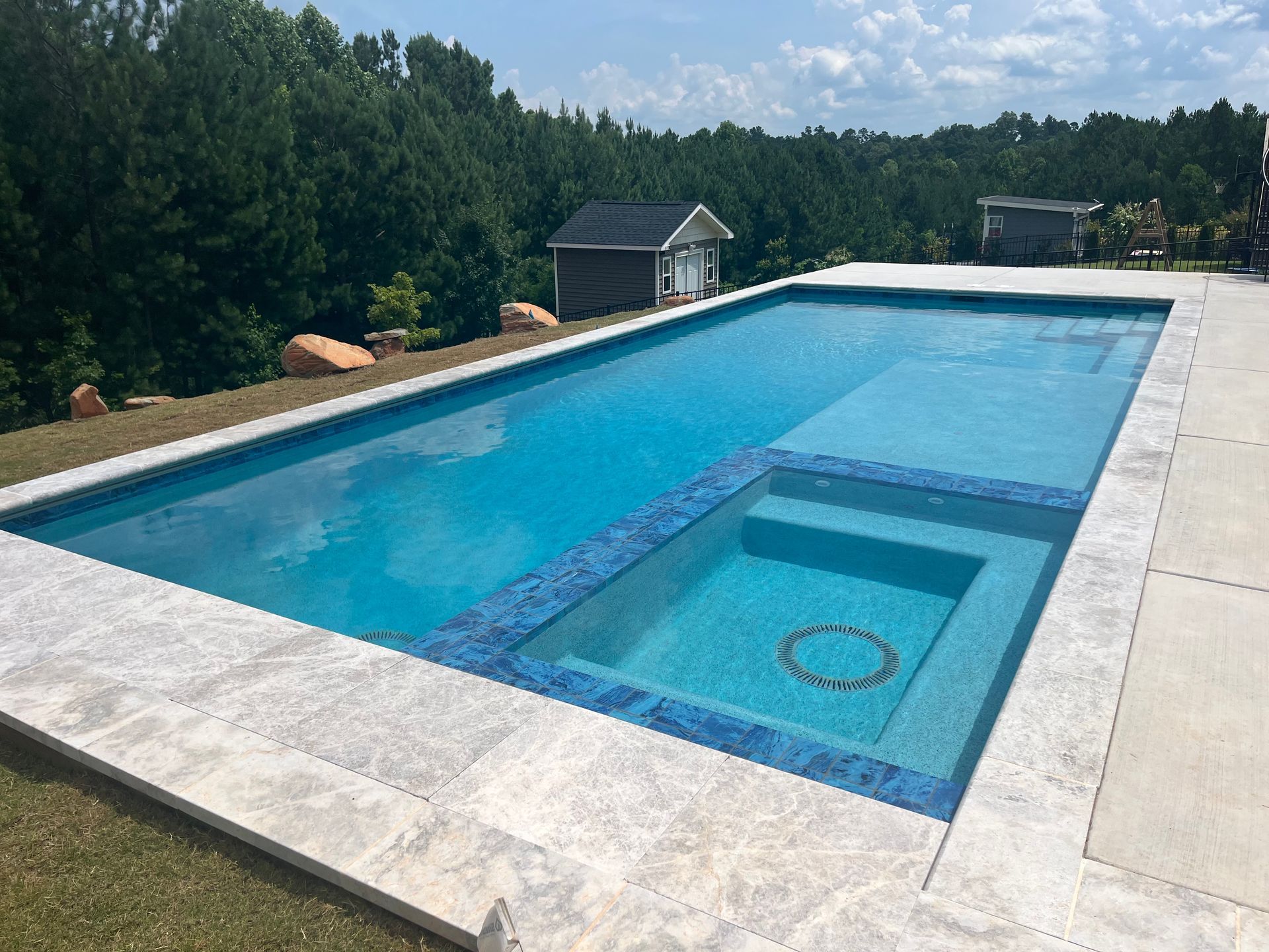 Pool with built in hot tub.