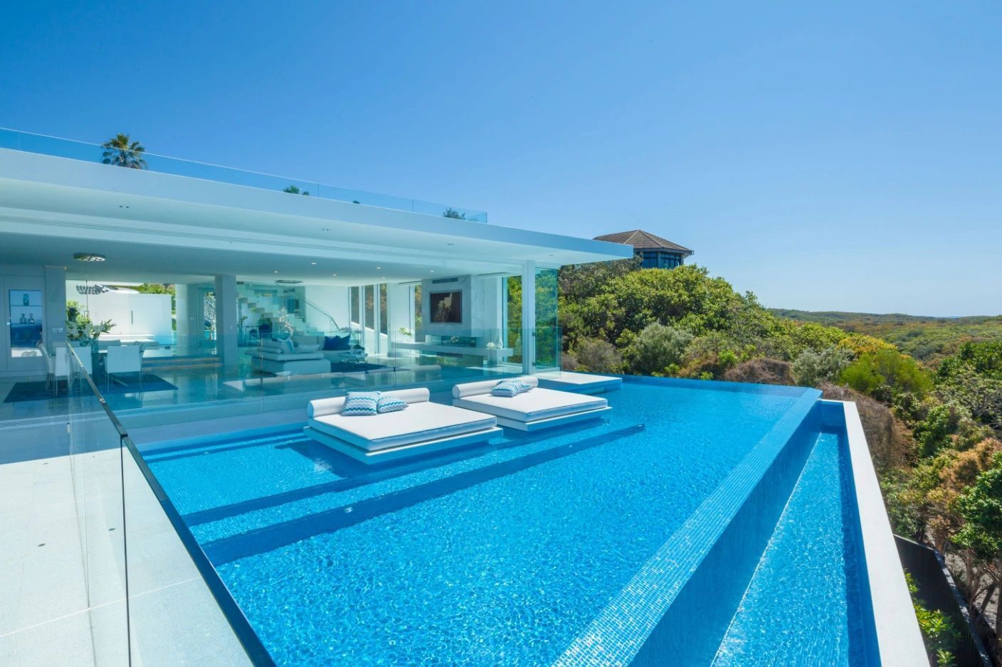 There is a large swimming pool in the middle of the house.