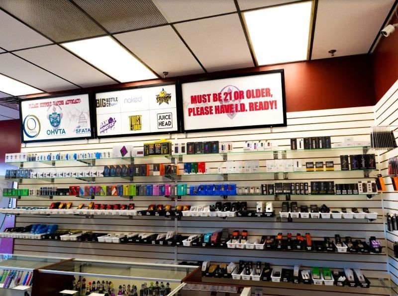 A store with a sign that says must be 21 or older