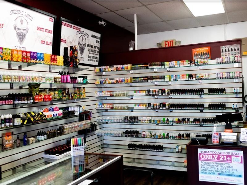 The inside of a vape shop with a sign that says only 21+