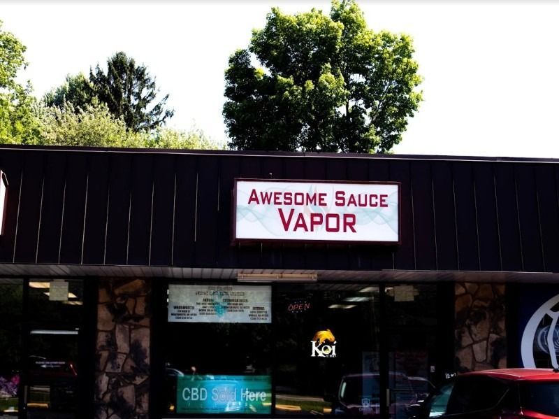 A store front with a sign that says awesome sauce vapor