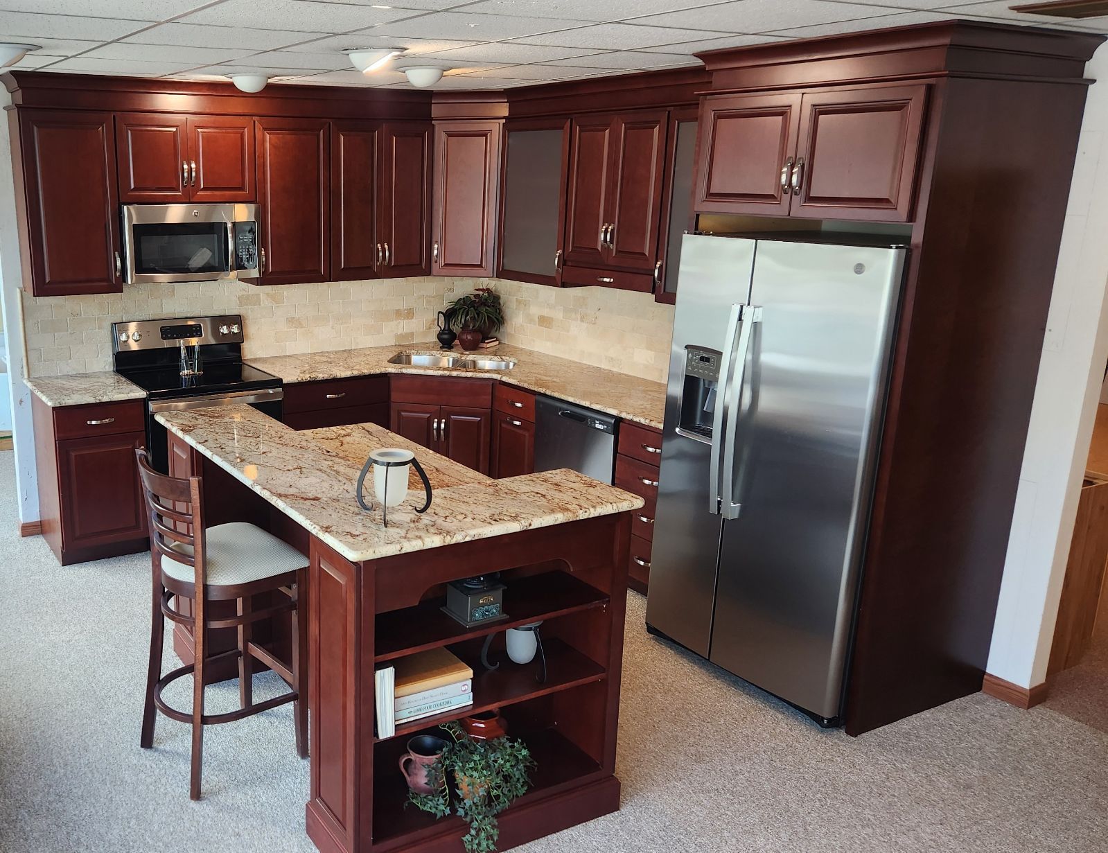 A kitchen with stainless steel appliances and granite counter tops