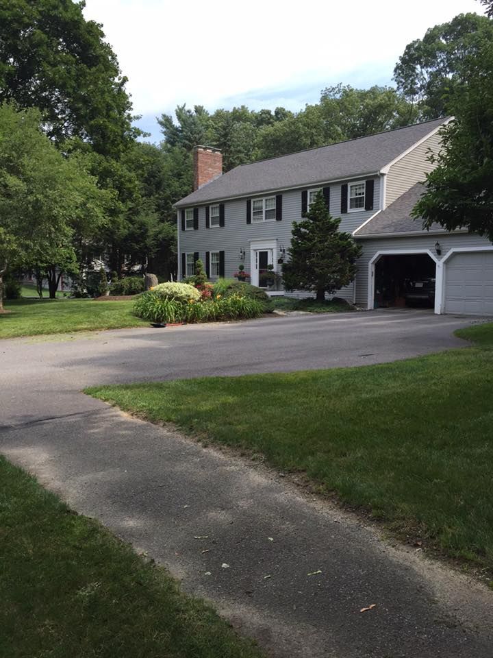 A large white house with a garage and a driveway