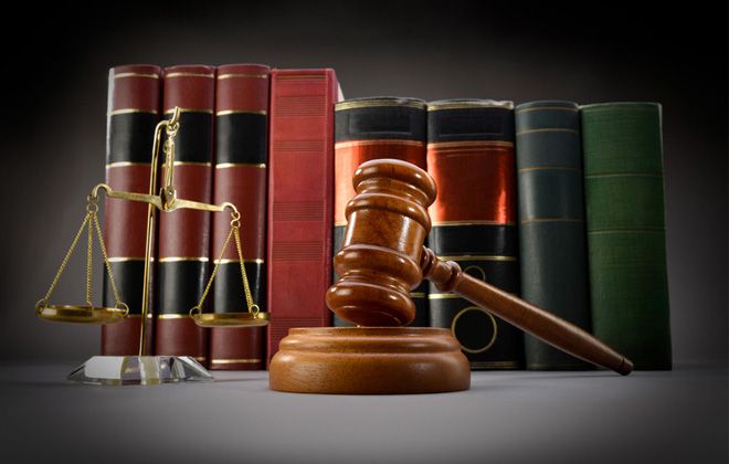 Scale of justice, gavel, and books