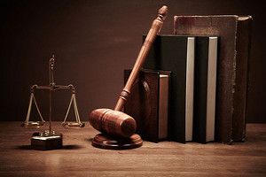 Scale of justice, gavel, and books