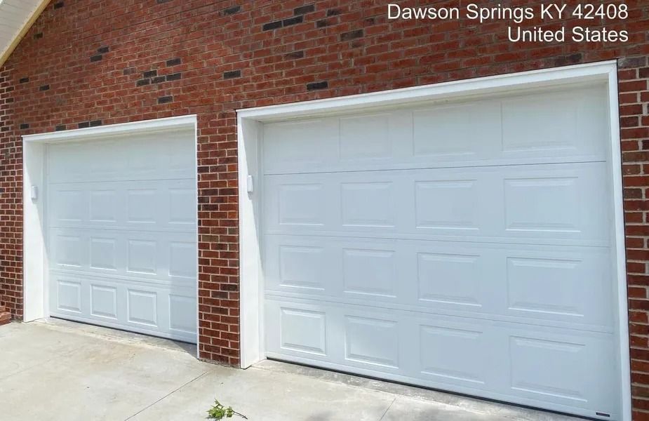 Two white garage doors on a brick building in Dawson Springs, KY, United States.