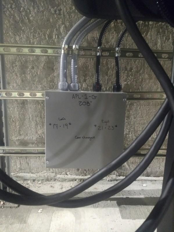 A box with a bunch of wires coming out of it.