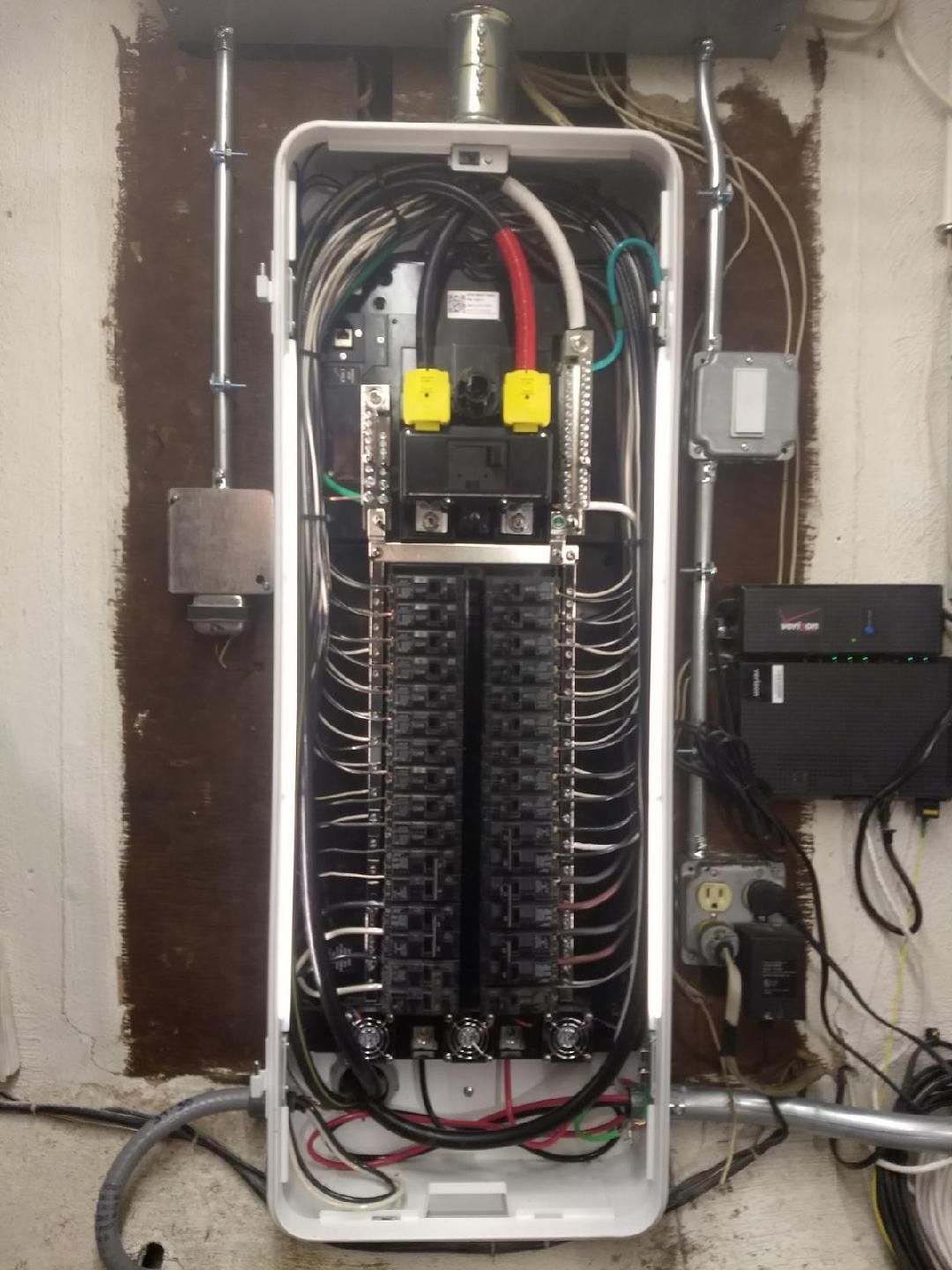 An electrical box with a lot of wires coming out of it