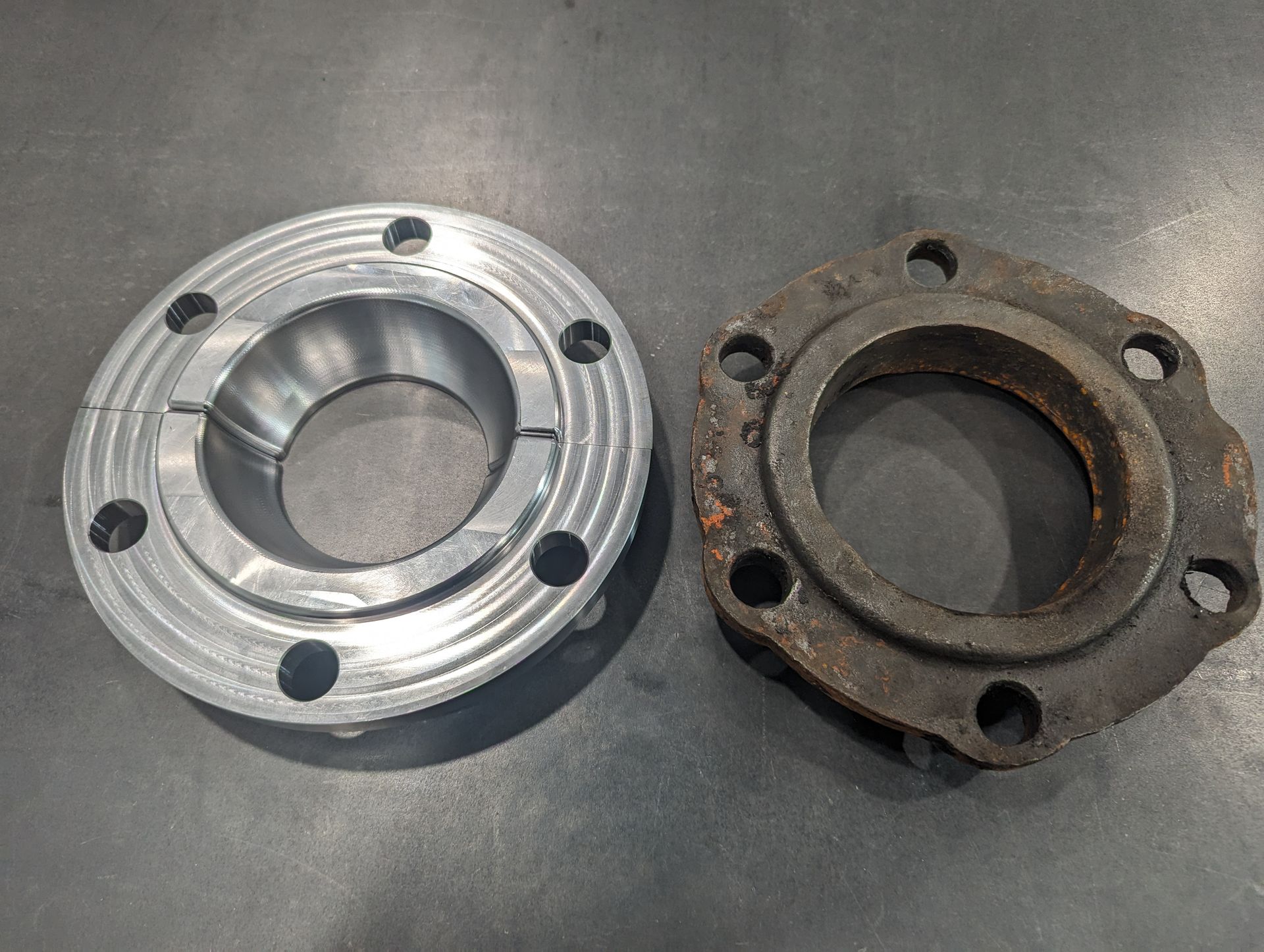 Two metal rings are sitting next to each other on a table.