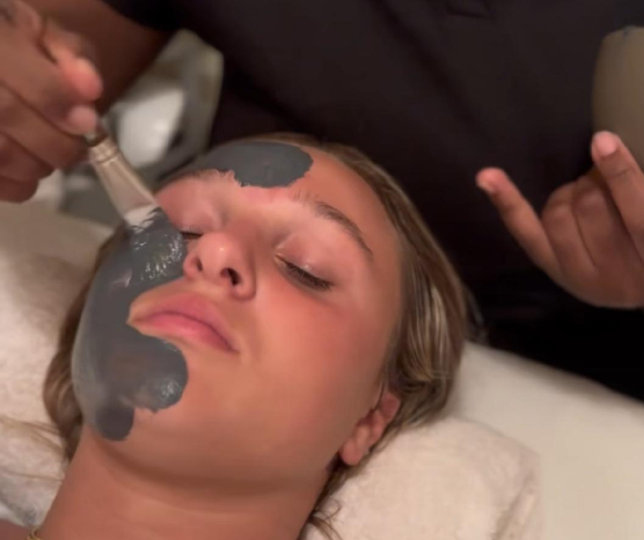 a woman having facial service