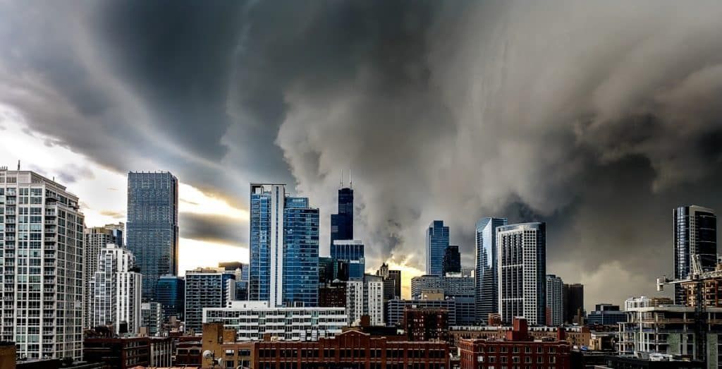 City skyline under a dark, stormy sky; ominous clouds loom over the buildings.