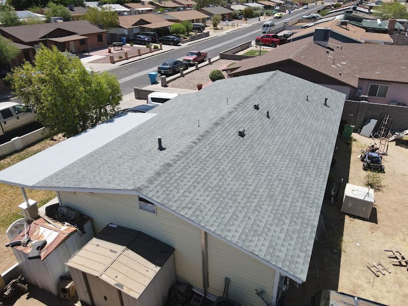An aerial view of a house with a new roof.