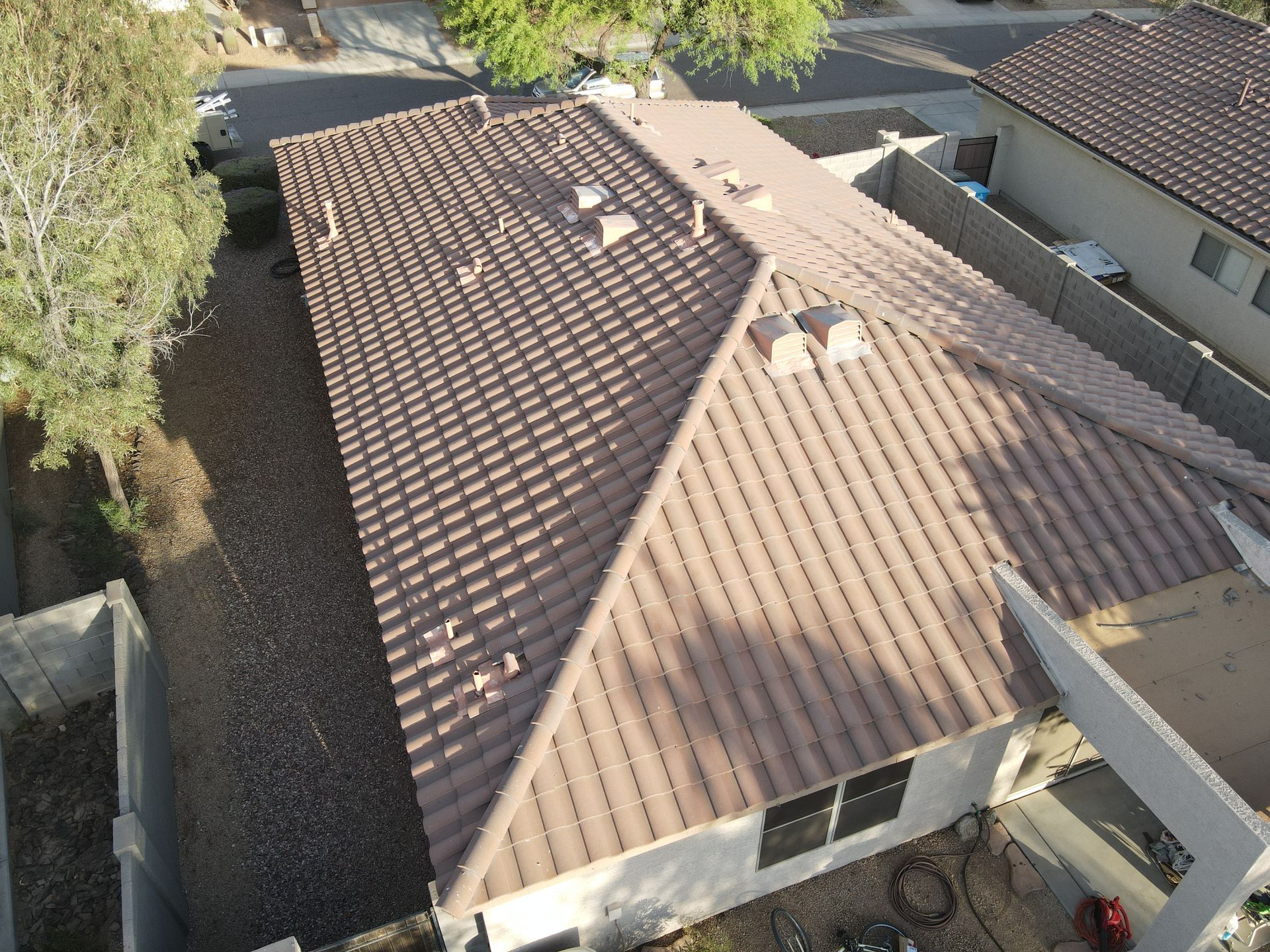 An aerial view of a house with a brown roof.