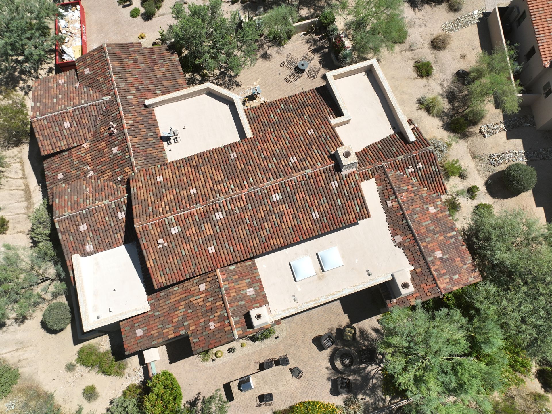 An aerial view of a large house with a tiled roof.