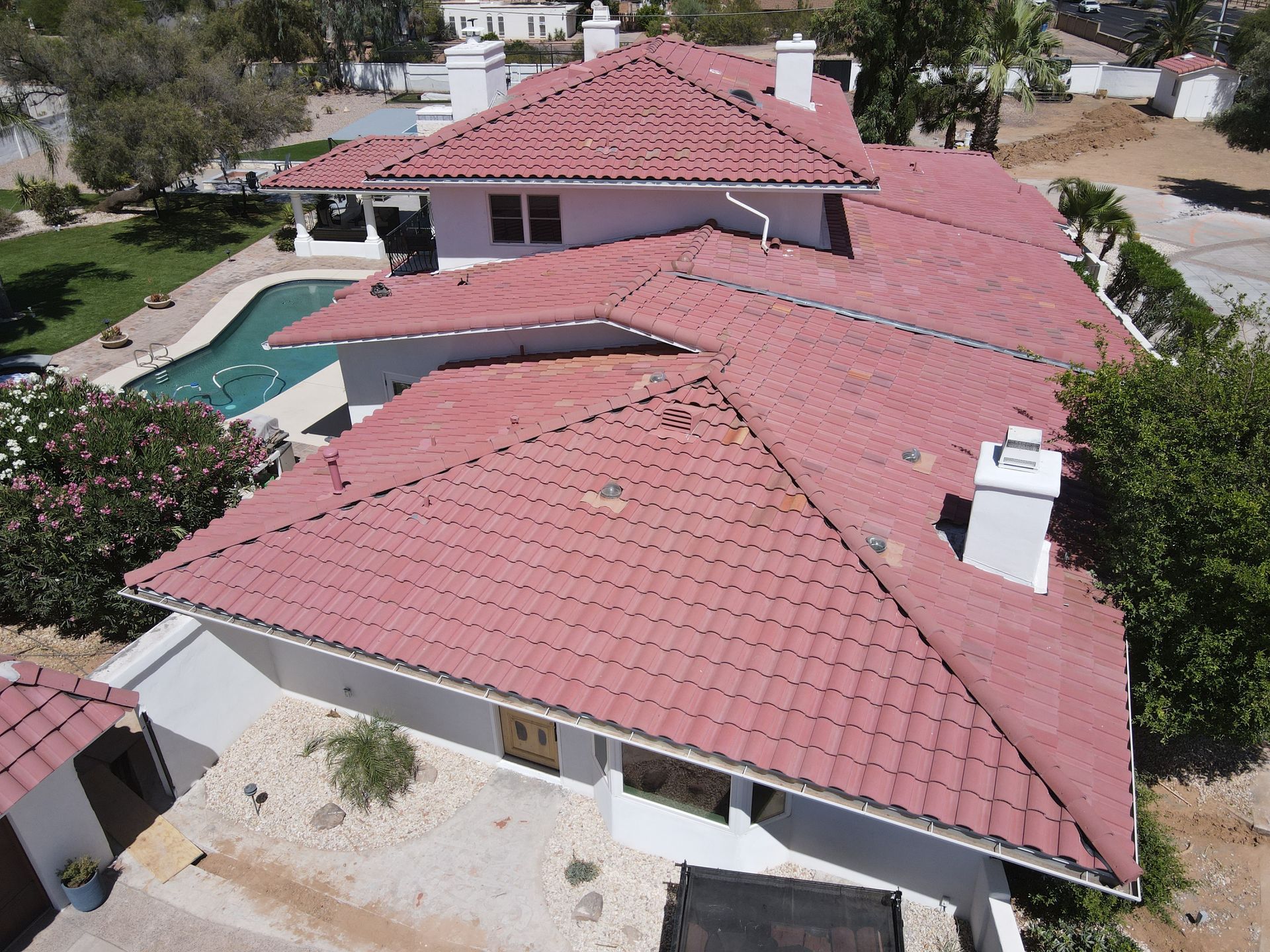 An aerial view of a house with a red tiled roof.
